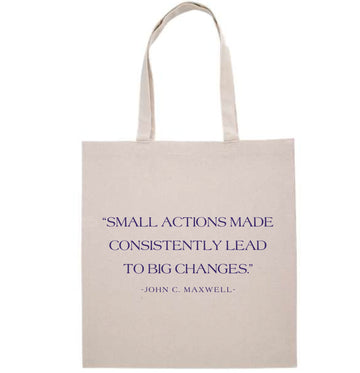 Beige tote bag with motivational quote on a white background