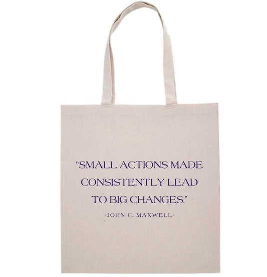 Beige tote bag with motivational quote on a white background